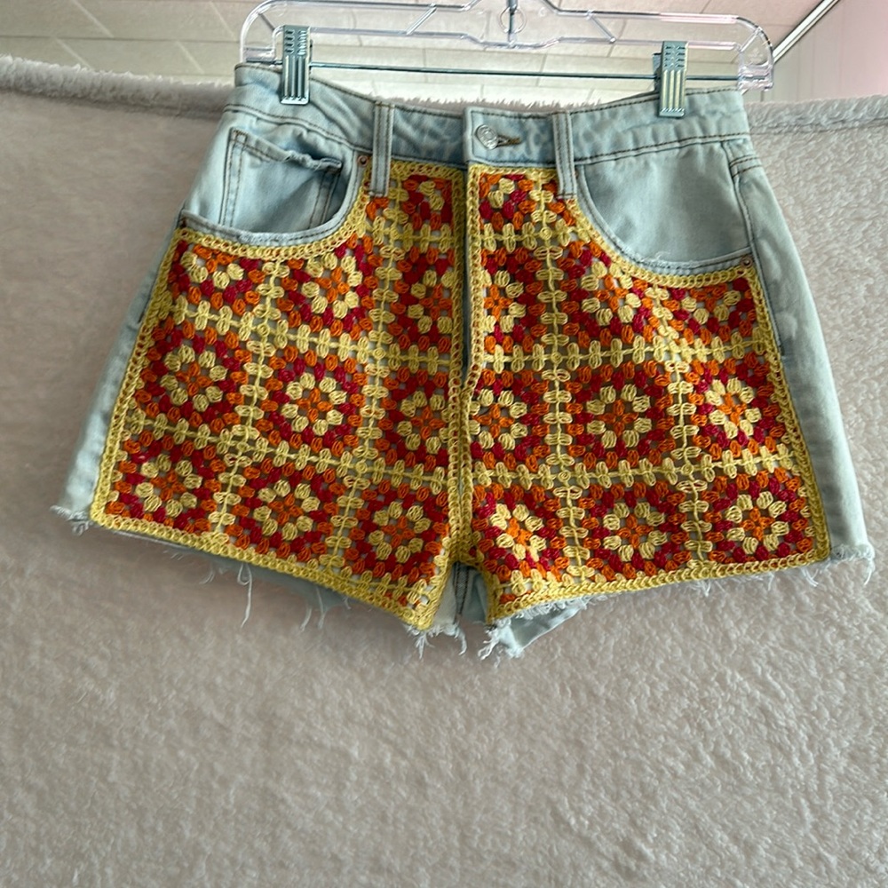 Wild Fable cutoff shorts with crocheted pattern on front. Size 6.